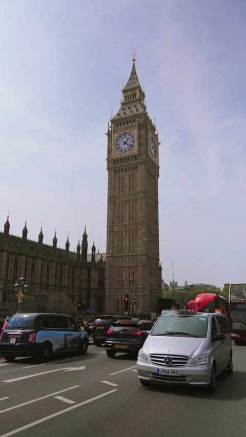 Traffic and Iconic Landmarks Close to Big Ben in London, a major tourist Stock Footage 310296894