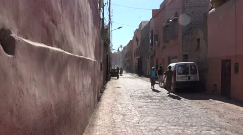 Traffic and movement down a typical inner street in Marrakesh Morocco. Stock Footage 62466286