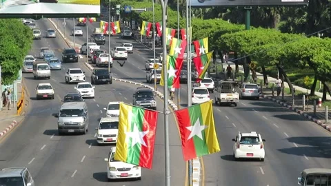 Traffic and Myanmar Flags in Yangon Stock Footage 325168288