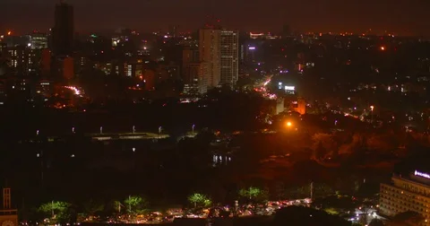 Traffic and Nairobi skyline on a cloudy night. Kenya, Africa. Stock Footage 81697266