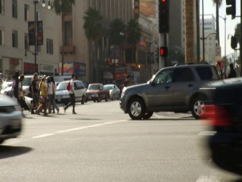 Traffic and people at intersection Stock Footage 106274998