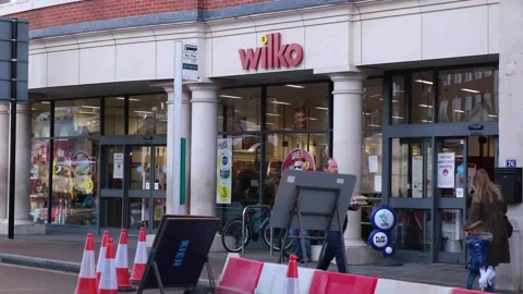 Traffic and Vehicles Passing Outside A Wilko Discount Store Stock Footage 162305502