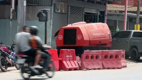 Traffic around a compressor on a city steet Stock Footage 210336919