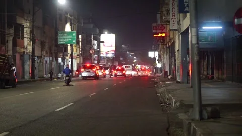 Traffic atmosphere at night crowded with motorbikes and cars on one of the main Stock Footage 337300955
