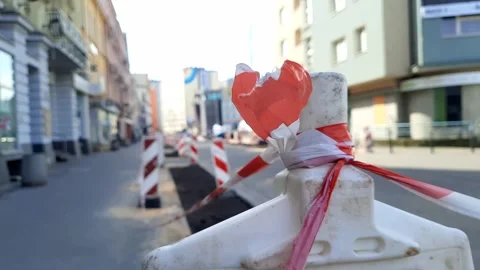 Traffic barrier with Caution tape on a blurred background of a city street. Stock Footage 269830267