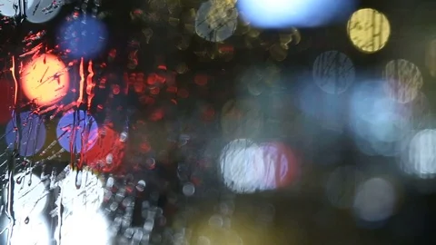 Traffic Behind Rainy Car Window Stock Footage 97780693