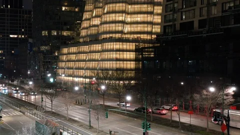 Traffic below Illuminated Office Building on Manhattan West Side 動画素材 126745836