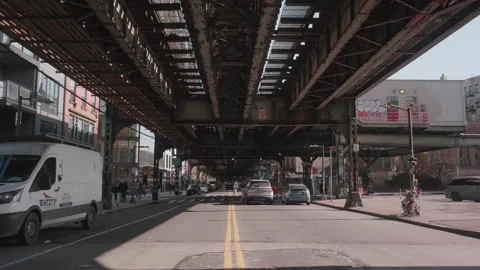Traffic beneath subway tracks Stock Footage 265553012