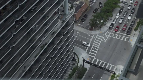 Traffic between buildings take from above Stock Footage 128076883