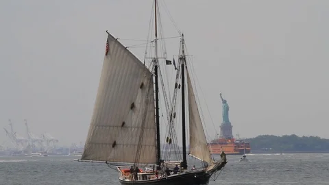 Traffic between the NY waterfront and the statue of Liberty Stock Footage 103057361