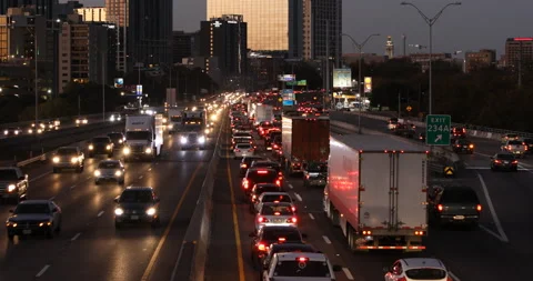Traffic bottlenecks to a stop on busy downtown interstate highway Stock Footage 146052019