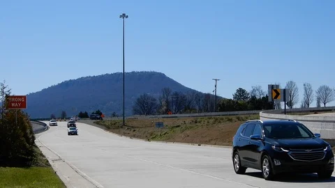 Traffic On Bridge Highway Freeway As Other Traffic Exits Stationary Shot Vie Stock Footage 129571340