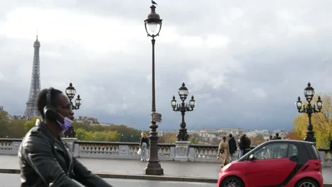 A Traffic on a Bridge of Paris with a view of Eiffel Tower, Paris autumn 2021 Stock Footage 164449272