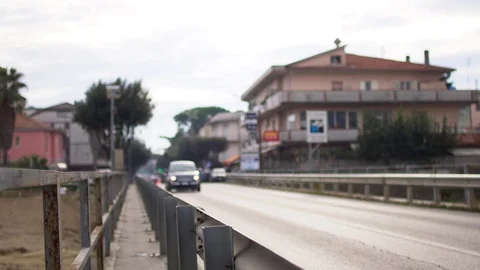 Traffic on a bridge in a small town with cloudy weather Stock Footage 83841927