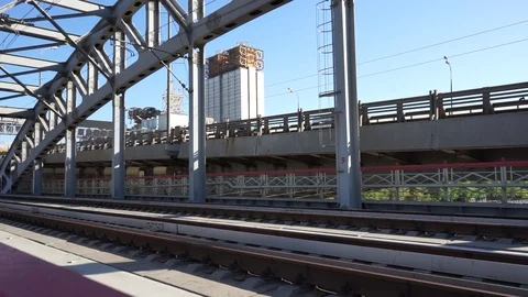 Traffic on a bridge, the train is passing by Video stock 89651980