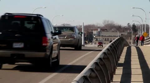 Traffic on Bridge with Walkers Stock-Footage 10738432