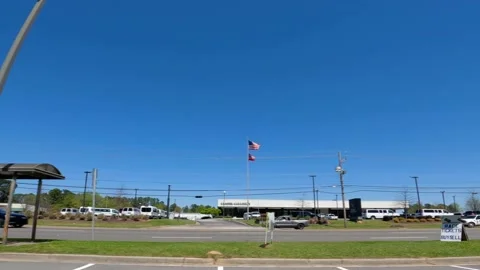 Traffic Bus Stop and a masters golf ticket tent Stock Footage 174384087