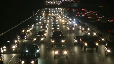 Traffic on the Busy Freeway at Night - Time Lapse Stock Footage 10711936