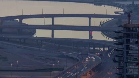 Traffic on a busy intersection in Dubai downtown night to day timelapse. Top Stock Footage 171997190