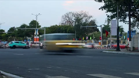 Traffic at a busy intersection before sunset Stock Footage 313325545
