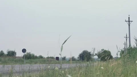 Traffic on a bypass road behind a small Eastern European town 스톡 동영상 202130864