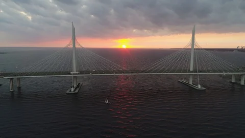 Traffic on the cable bridge during sunset in Saint-Petersburg Stock Footage 127534336