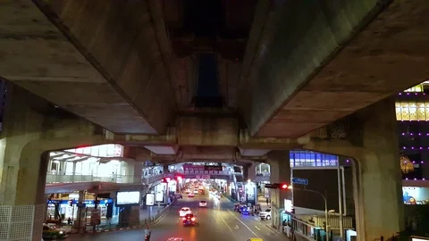 Traffic at carrefour under a concrete structure - Bangkok - time lapse 4K Stock Footage 97123761