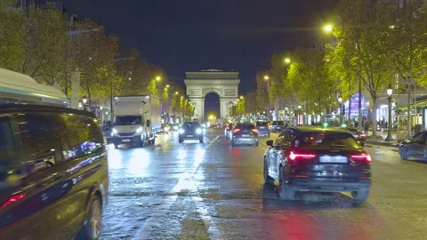 Traffic on Champs Elysees at Night Stock Footage 324495686