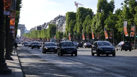 Traffic on the Champs Elysees in Paris in evening Stock Footage 76309609