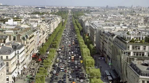 Traffic on Champs-Elysees with tree-lined street - cars in gridlock Paris France Stock Footage 93930957