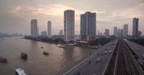 Traffic on Chao Phraya River Bridge at Sunset, Bangkok, Thailand Video stock 75308904
