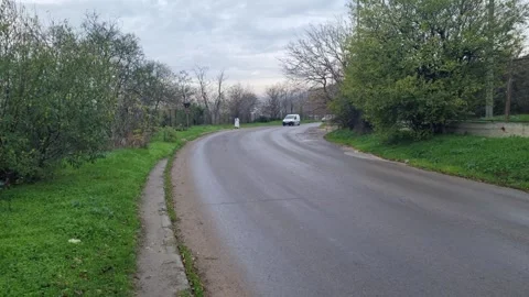 Traffic at city intersection after rain in Varna, Bulgaria Stock Footage 322193078