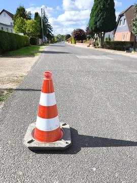 A traffic cone on an empty road 스톡 사진