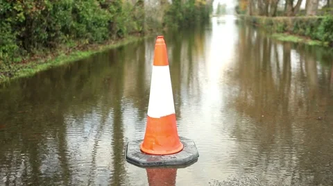 Traffic cone at flooded road Stock Footage 44639890