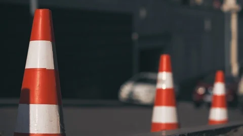 Traffic cones are installed along the road on a city street  Видео 126005760