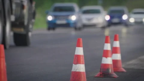 Traffic Cones Mark Lane Closure During Road Repair and Road Work on Highway.. Stock Footage 339142432