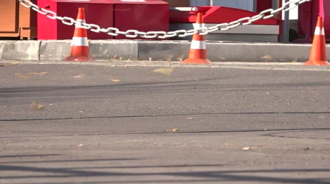 Traffic cones. A strong wind blows away the leaves. Video stock 55272905