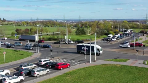 Traffic congestion at an intersection in a busy urban area showcasing vario.. Stock Footage 296095010