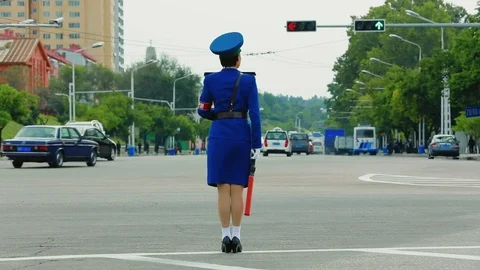 The traffic controller on the busy street of Pyongyang Video stock 84117492