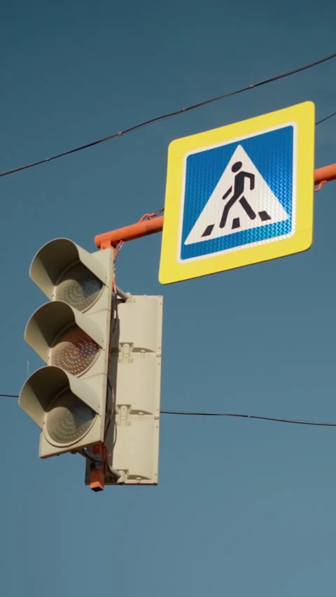Traffic controller overseeing pedestrian movement, Urban intersection with Stock Footage 323631217
