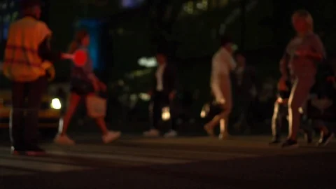 Traffic controller stopped the cars so that pedestrians could cross the road Stock Footage 121801069