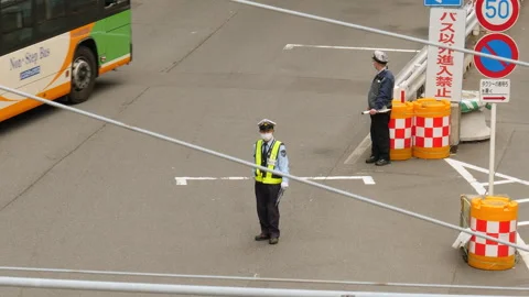 Traffic controllers with little work at Shibuya station. Tokyo, Japan. Stock Footage 246410294