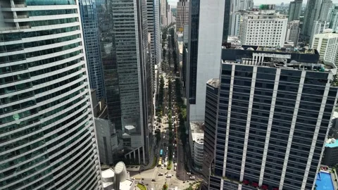 Traffic Corridor Between Modern Office Towers in Makati 스톡 동영상 330875004