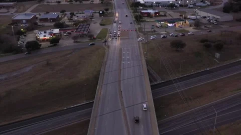 Traffic Crossing a Bridge over a Freeway at Dusk, Bryan, Texas, USA Stock Footage 145950819