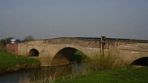 Traffic crossing the river derwent at bubwith yorkshire uk Stock Footage 49157275