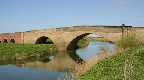 Traffic crossing the river derwent at bubwith yorkshire uk Stock Footage 49762455