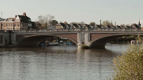 Traffic crossing the river Thames over the Hampton Court Bridge, UK Stock Footage 145831222