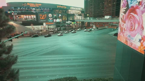 Traffic crossing a wide intersection on the Las Vegas Strip Stock Footage 347836861