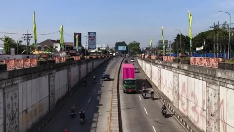 Traffic density of motor vehicles in the underpass. East Java - October 1, 2025 Stock Footage 323673759
