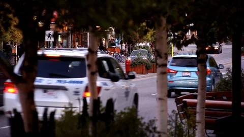 Traffic downtown Banff with a pan Stock Footage 101988077